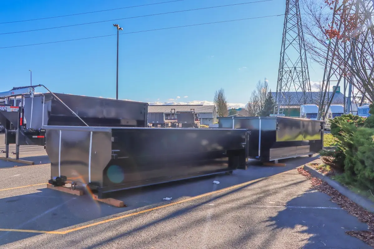 Roll-off dumpster ready for waste disposal at job site for 2 Yard Dumpster Rental in Amity